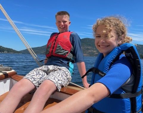 Maple Bay youth sailors on the yacht Dorothy's helm in 2025.