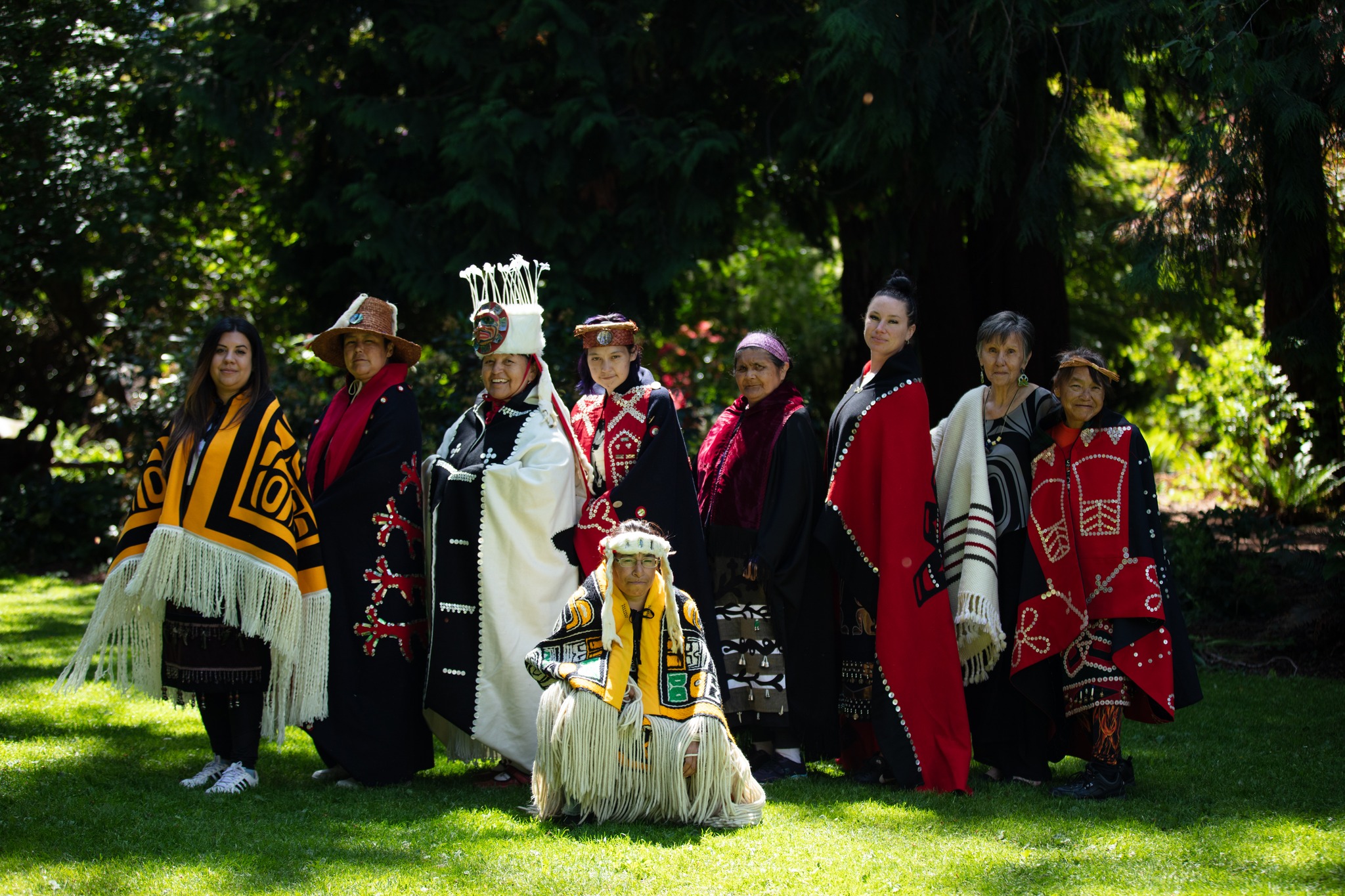Aunty Glo shares traditional Regalia with the women from SPAKEN House for a fashion show healing circle at Beacon Hill Park.