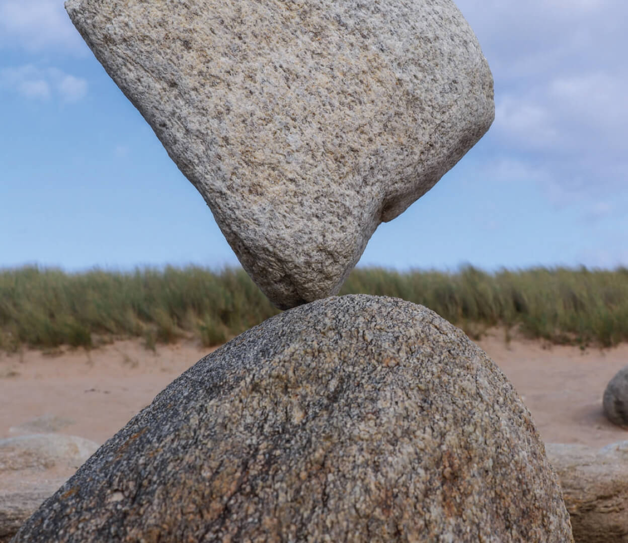 An image of two rocks balanced on each other from the cover of the State-of-the Sector report.