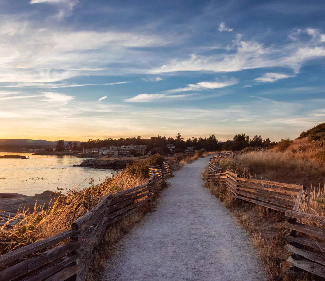 A path alongside Dallas Road in Victoria BC at sunset.