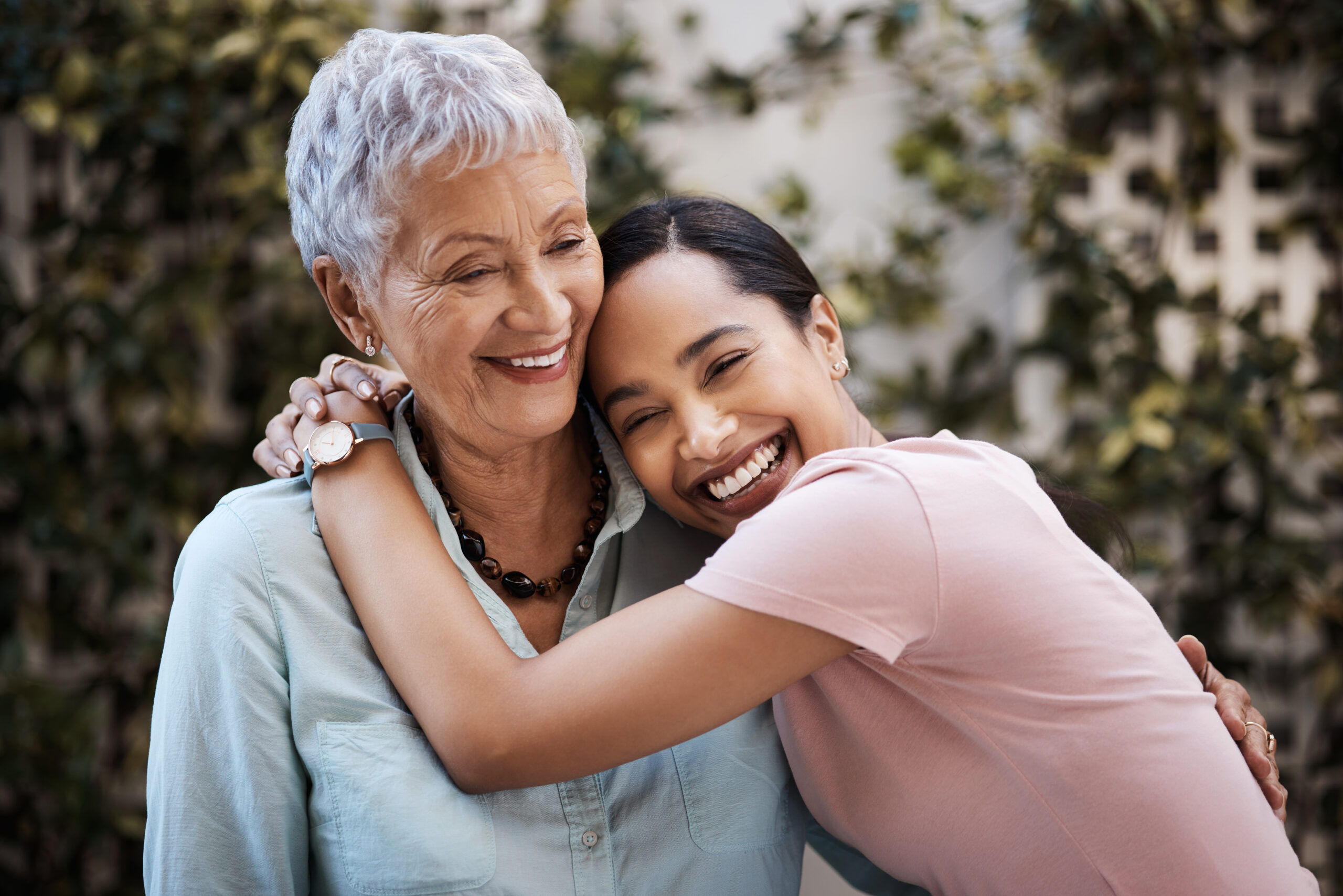 Shot of a senior woman spending time with her daughter in their garden at home Victoria Foundation building