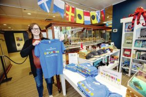 Brittany Vis shows off Maritime Museum t-shirt promoting Queer at Sea exhibit.