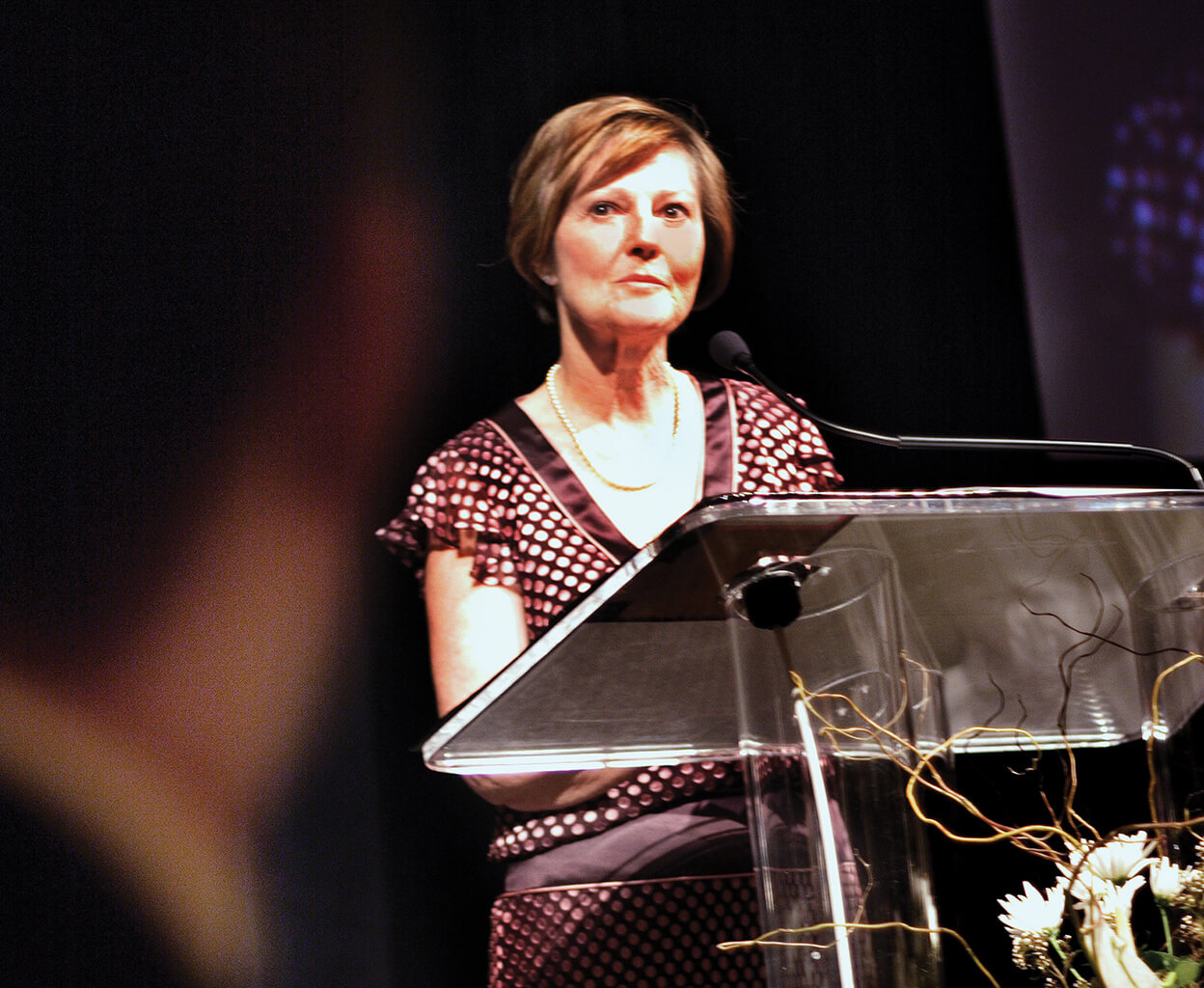 Sandra Richardson speaking at a lecturn