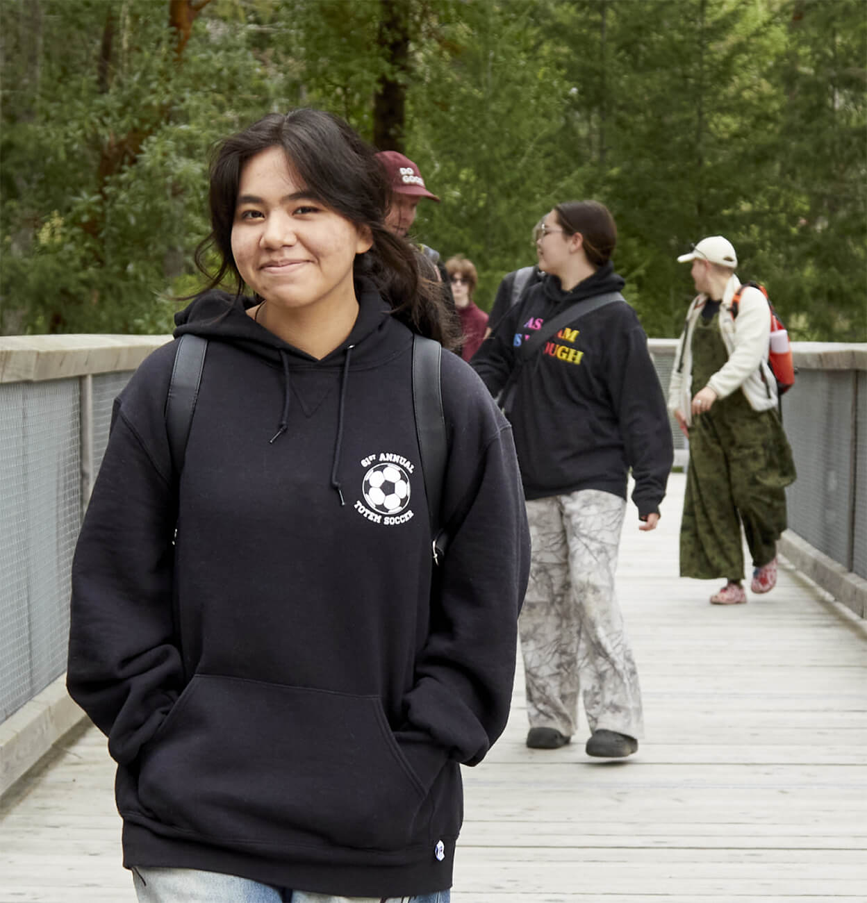 Inside Take a Hike's approach to youth mental wellness Take a hike! Youth on a hike, crossing a bridge